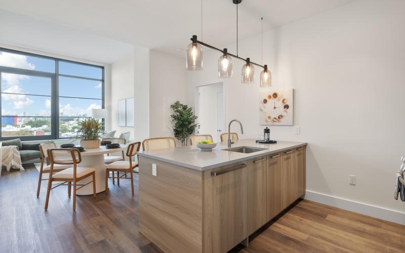 a kitchen with a table and chairs