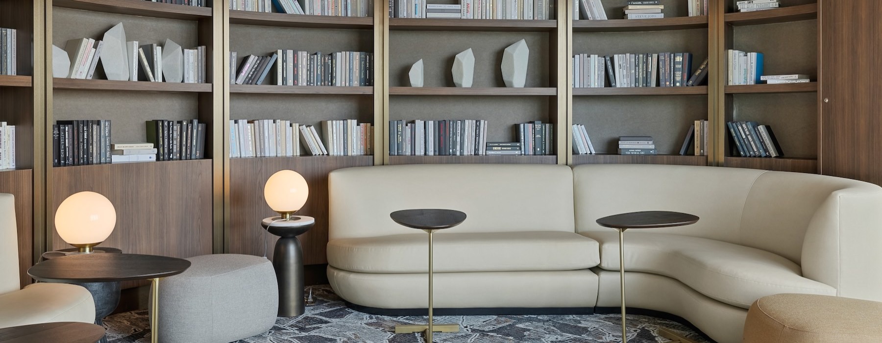 a room with a bookcase and a couch