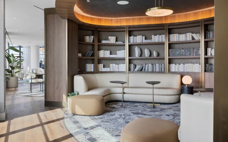 a room with a bookcase and a couch